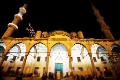 Low angle view of illuminated buildings at night