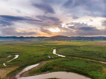 Scenic view of landscape against sky during sunset