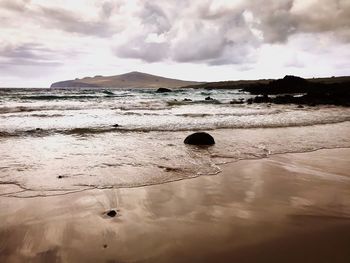 Scenic view of beach against sky