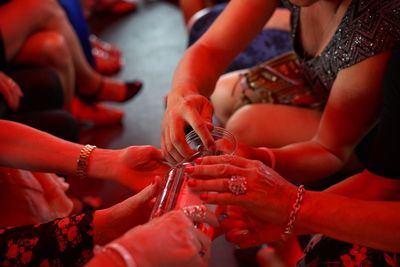 Women sharing drinks at party