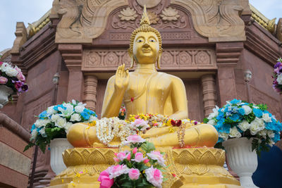 Statue of buddha outside building