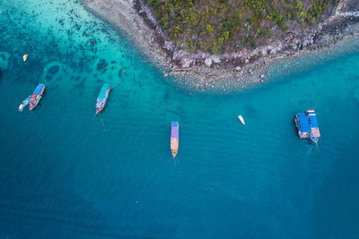 Aerial view of boats moored sea