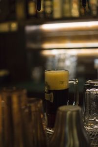 Close-up of beer glass on table