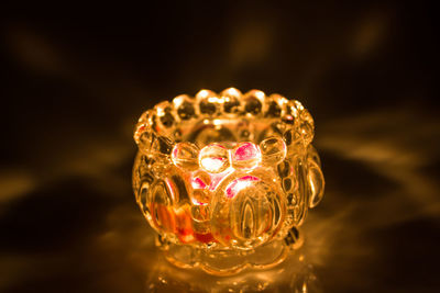 Close-up of illuminated decoration on table