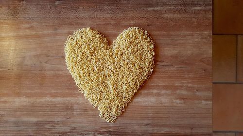 Close-up of heart shape noodles on table