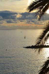 Scenic view of sea against sky at sunset