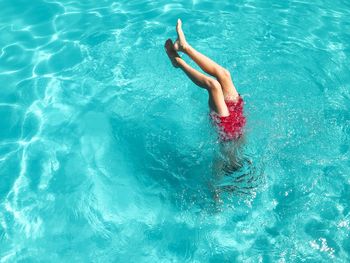 High angle view of woman swimming in pool