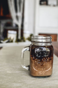 Close-up of coffee in jar on table