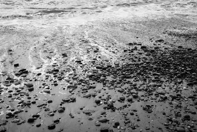 Close-up of wet sand on beach