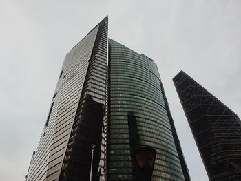 Low angle view of modern buildings against sky