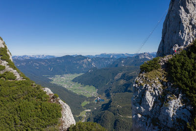 Scenic view of mountains against clear blue sky