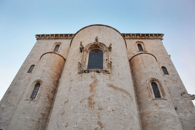 Low angle view of bell tower against sky