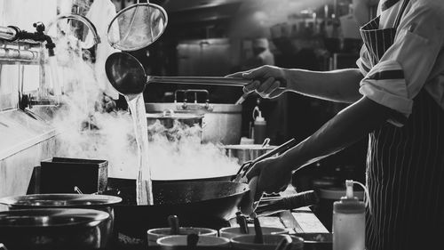 Man having food in kitchen