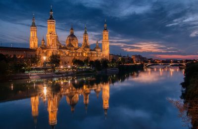 Reflection of illuminated buildings in water