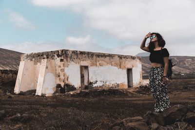 Woman standing against sky