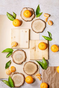 High angle view of fruits and leaves on table