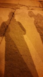 Shadow of people on wall