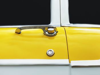 Close-up of yellow car door