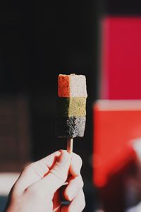 Close-up of hand holding ice cream