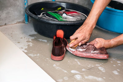 Close-up of man preparing food in kitchen