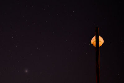 Low angle view of street light against sky at night