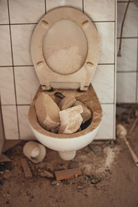 Close-up of abandoned objects in bathroom