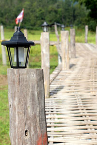 Close-up of wooden post on field