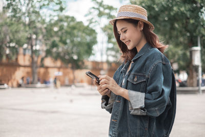 Young woman using mobile phone