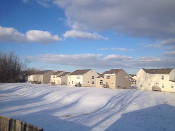 Houses on snow covered landscape