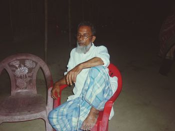 Portrait of man sitting on chair