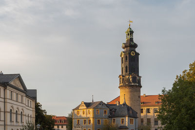 Low angle view of buildings in city against sky