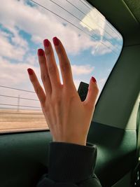 Hand in the car window