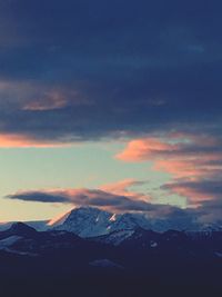 Scenic view of mountains against sky during sunset