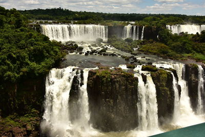 Scenic view of river and waterfalls