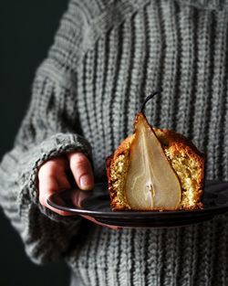 Close-up of man holding cake