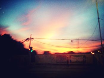 Scenic view of landscape against sky at sunset