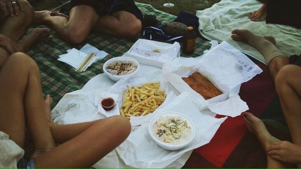 person, holding, food and drink, lifestyles, leisure activity, part of, food, men, freshness, high angle view, sitting, togetherness, indoors, cropped, human finger