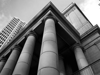 Low angle view of office building against sky