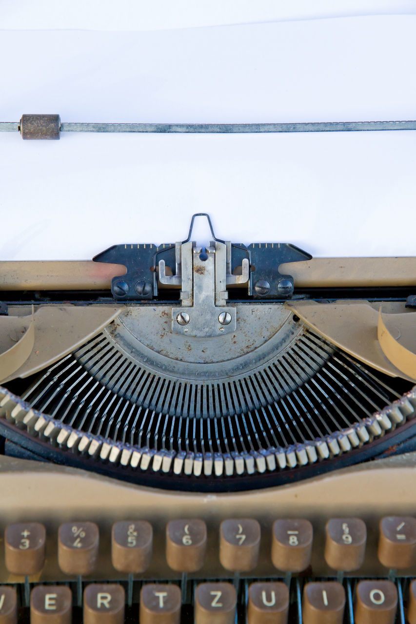 CLOSE-UP OF MACHINE PART WITH BLUE AND EQUIPMENT