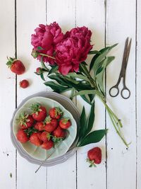 High angle view of red flowers on table