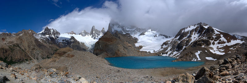 Panoramic view of snowcapped mountains against sky during winter