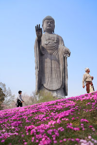 Low angle view of statue against sky