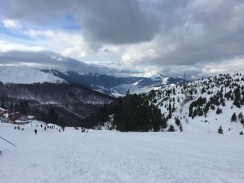 Scenic view of snowcapped mountains against sky