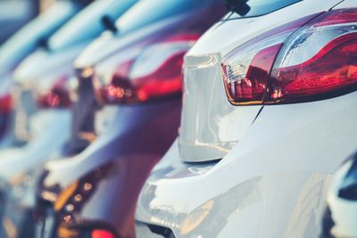 Close-up of cars in parking lot