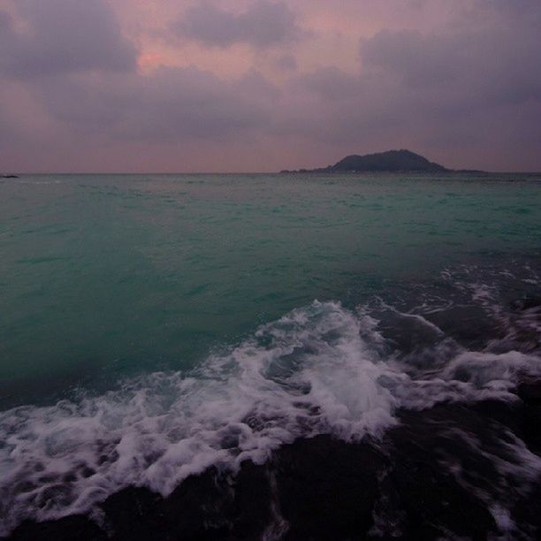 sea, water, scenics, beauty in nature, sky, horizon over water, tranquil scene, wave, nature, cloud - sky, tranquility, rock - object, idyllic, surf, cloudy, seascape, waterfront, sunset, motion, dusk