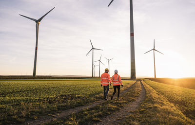 Engineers walking at wind park