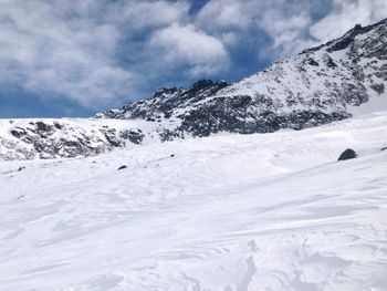 Scenic view of snow covered mountains