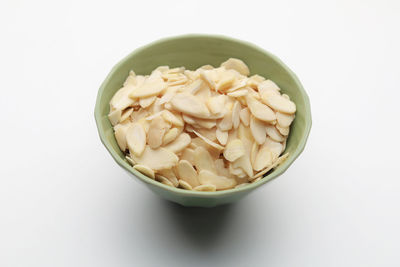 High angle view of pasta in bowl against white background