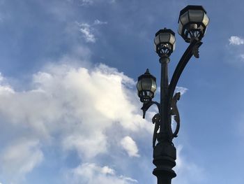 Low angle view of street light against sky