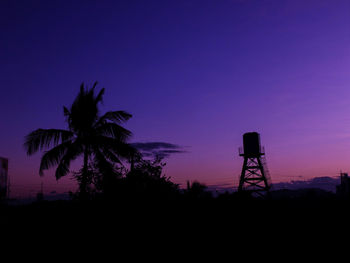 Low angle view of silhouette trees against sky at sunset